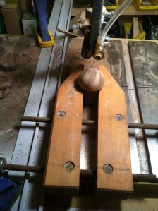 Next I headed to the band saw in order to cut the pegs cleanly in half. I don't use these wooden clamps often enough, but sometimes they really come in handy!