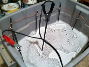 The positive is attached the rods and the negative attached to the tools.